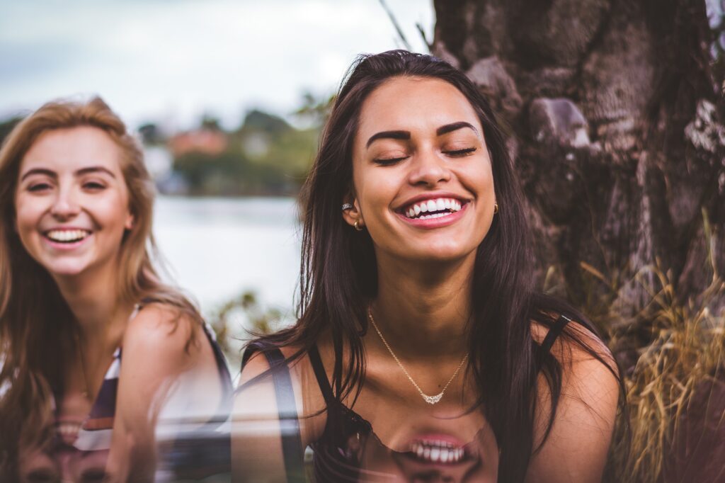 Smiling girls living a happy life, 10 ways to increase joy