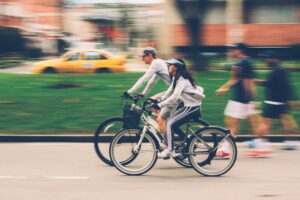 Show people biking to work.